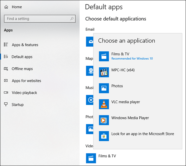 Head to Settings > Apps > Default Apps, then click the Video Player option