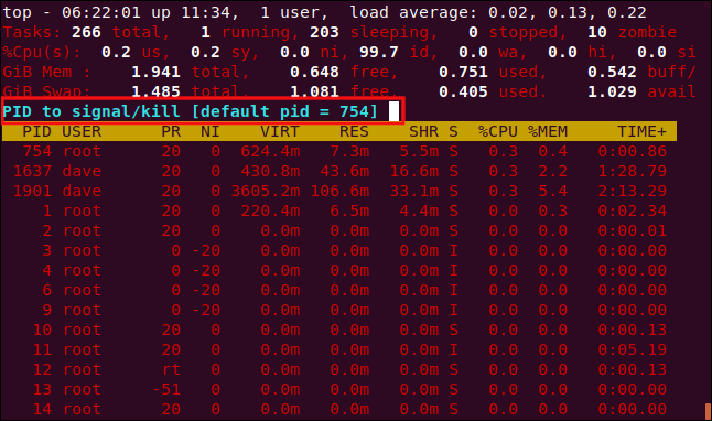 top with a cyan prompt, in a terminal window.