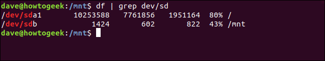 piping df through grep with a floppy drive attached in a terminal window