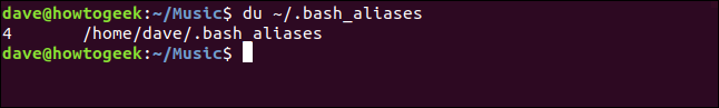 The "du ~/.bash_aliases" command in a terminal window.