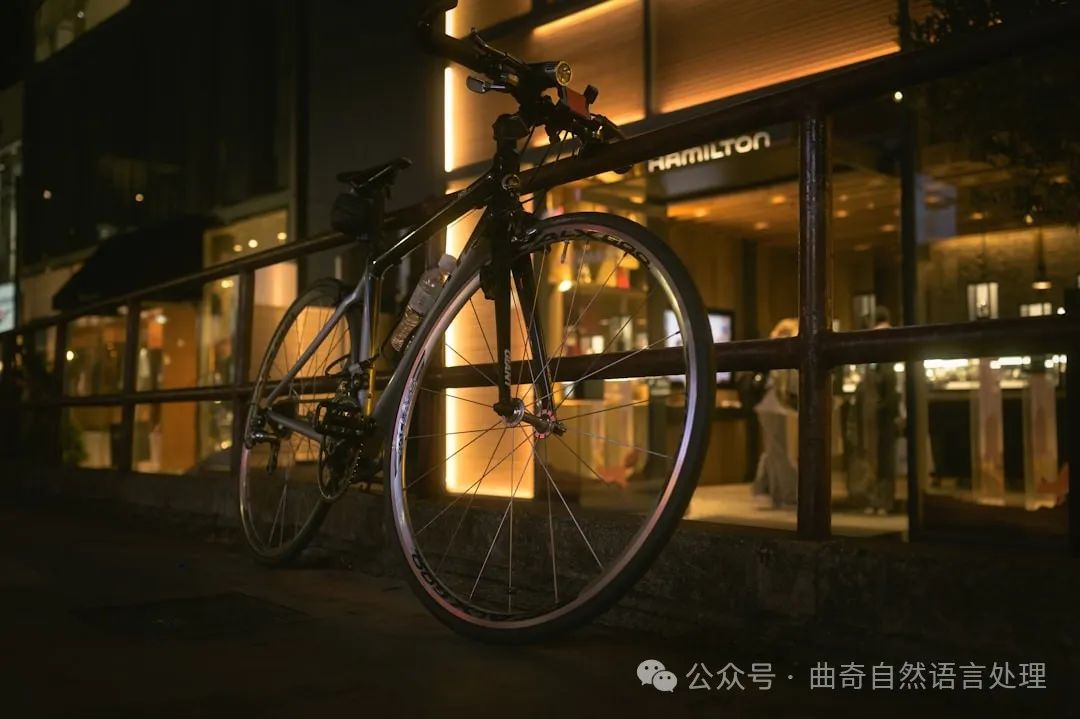 a bicycle parked on the side of a street