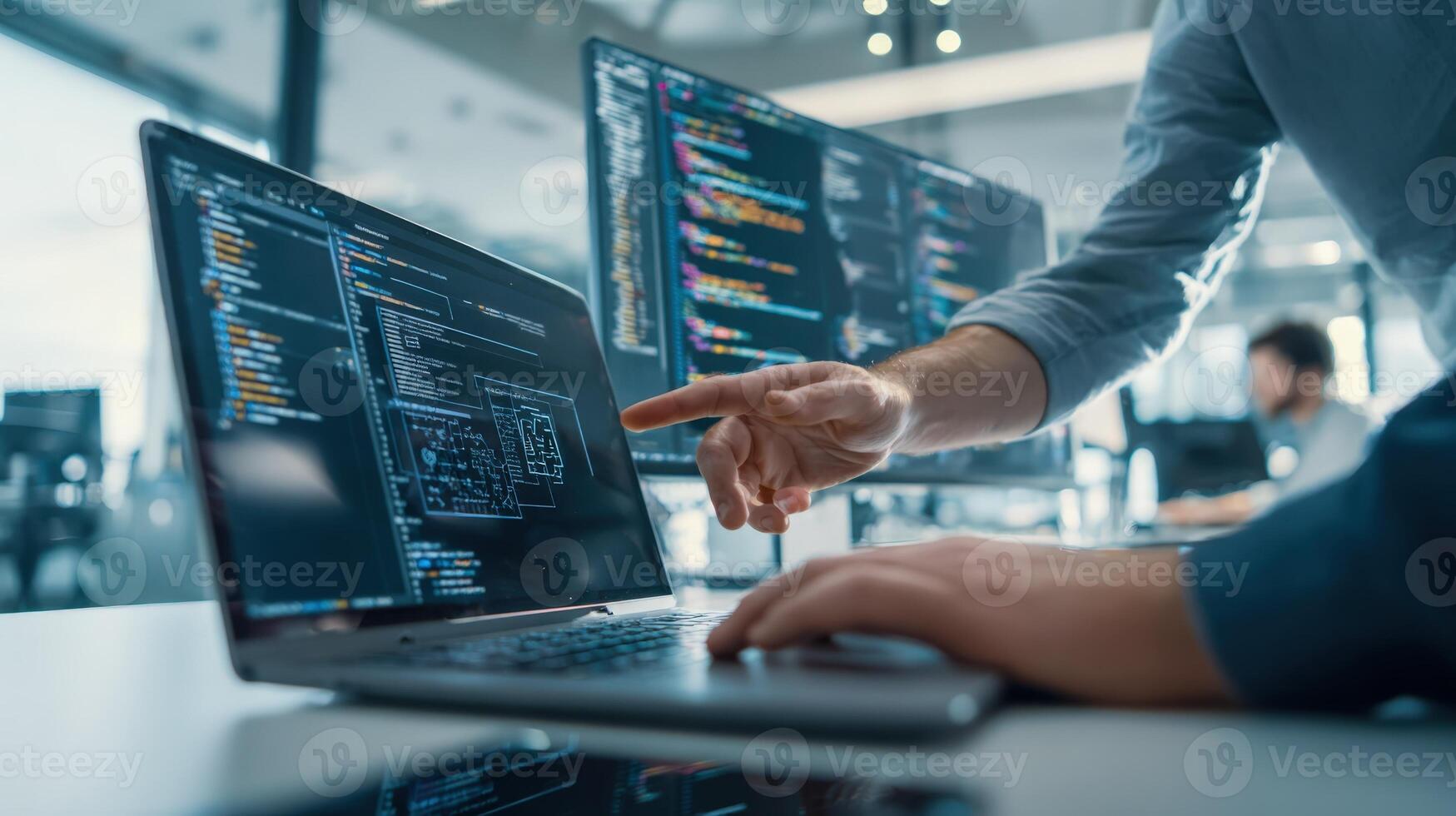 Software Developer Working with Code on Laptop and Desktop Monitors in Modern Office Environment 70720940 Stock Photo at Vecteezy